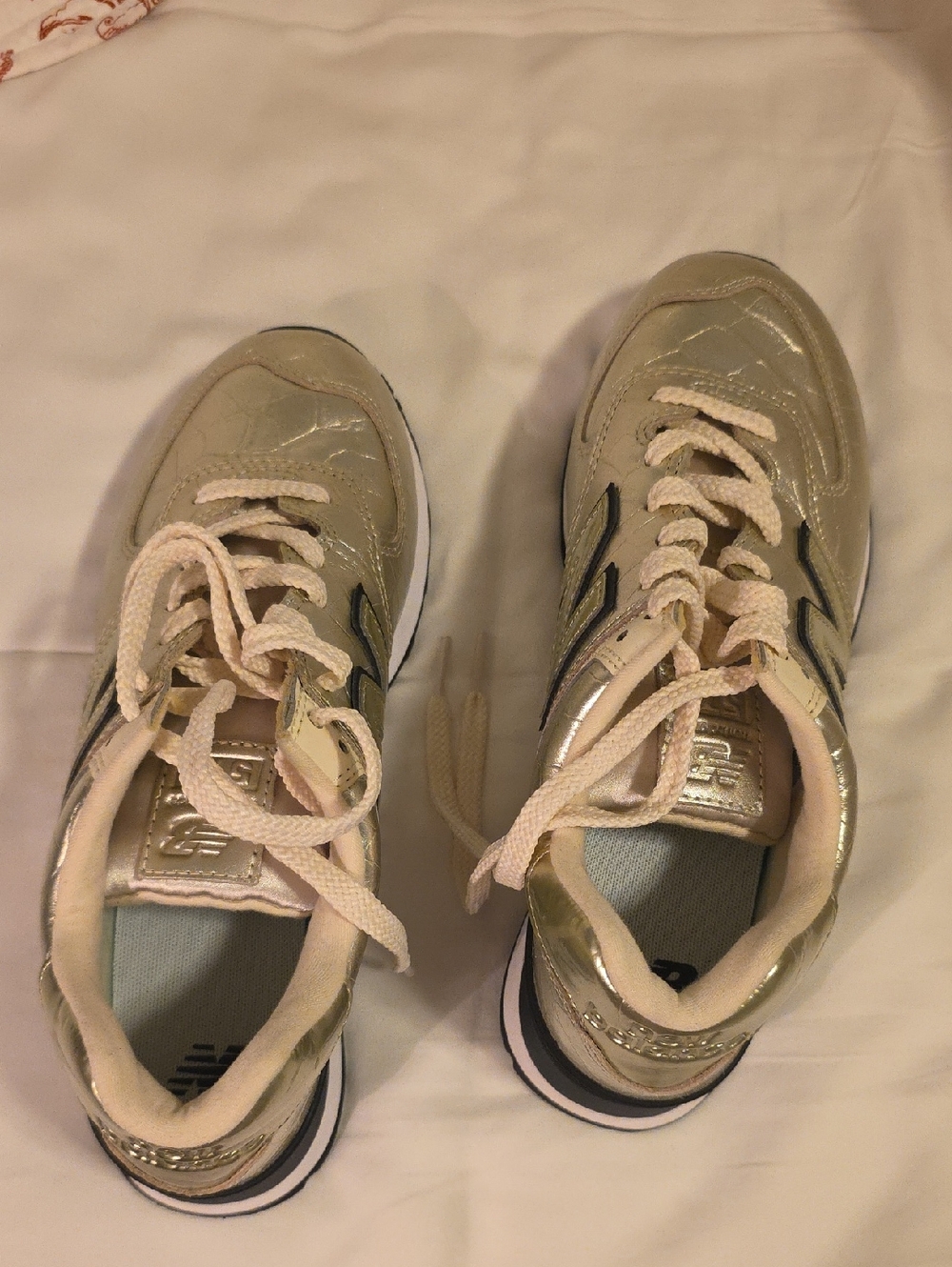 New Balance Metallic Gold and Black Sneakers